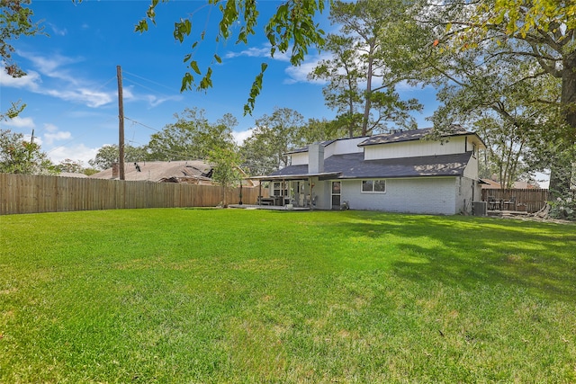 view of yard featuring central AC unit