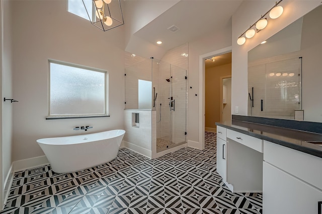 bathroom featuring vanity and separate shower and tub