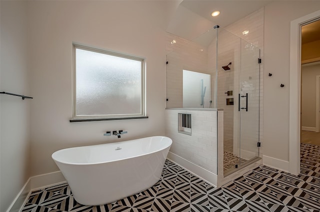 bathroom featuring separate shower and tub