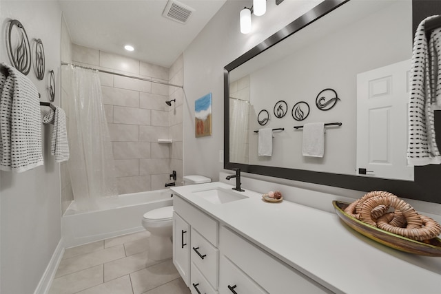 full bathroom featuring tile patterned flooring, vanity, shower / tub combo with curtain, and toilet