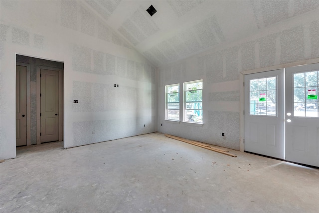 empty room with lofted ceiling