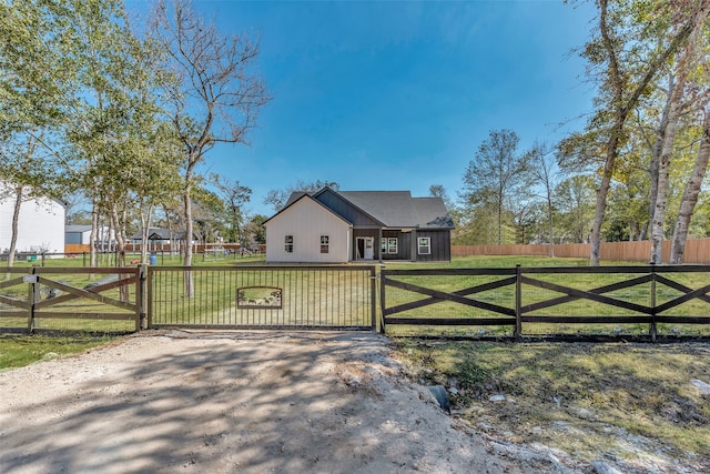 view of gate featuring a lawn