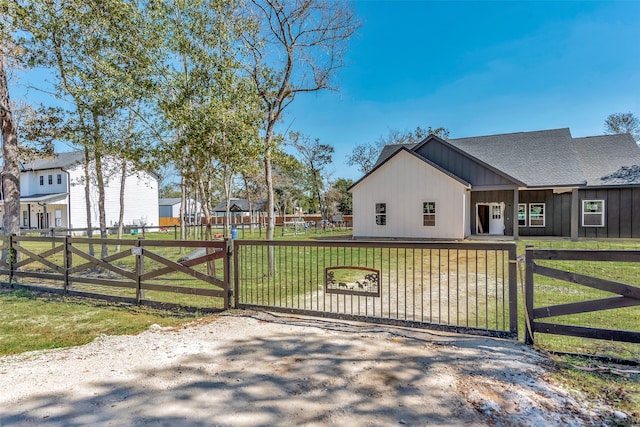 view of gate featuring a yard