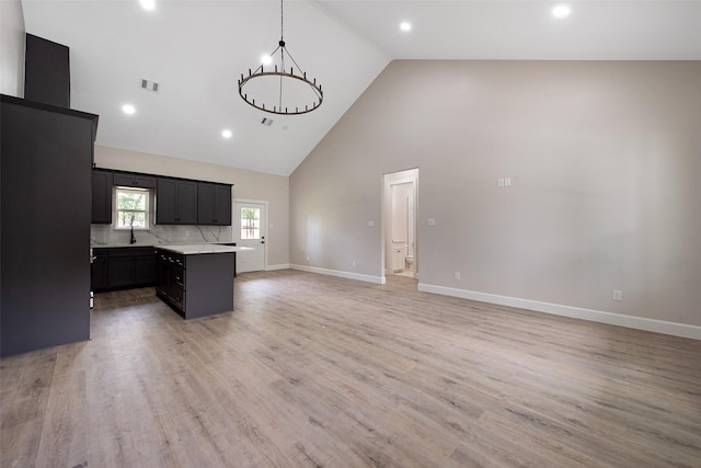 24601 Tipperary St, Hempstead, TX 77445 - kitchen featuring light countertops, high vaulted ceiling, a center island, open floor plan, and visible vents