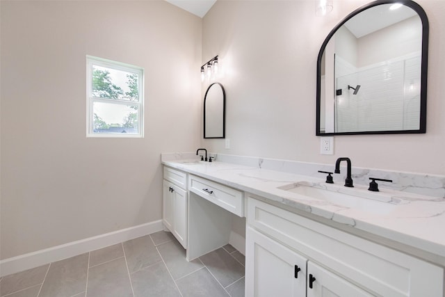 24601 Tipperary St, Hempstead, TX 77445 - bathroom with double vanity, baseboards, tiled shower, and a sink