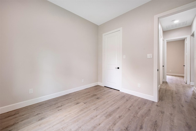 24601 Tipperary St, Hempstead, TX 77445 - unfurnished bedroom with baseboards and light wood-style flooring