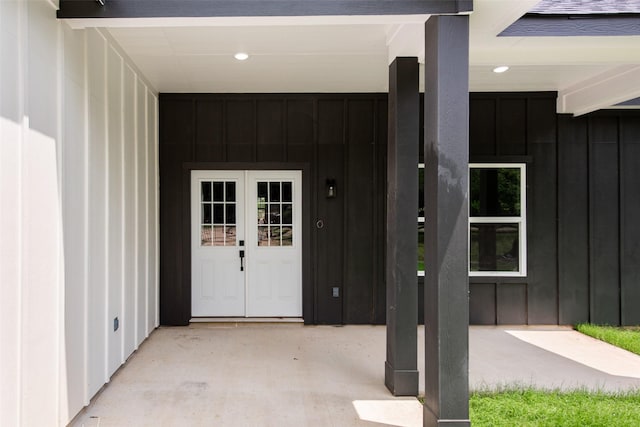 24601 Tipperary St, Hempstead, TX 77445 - property entrance featuring board and batten siding and french doors