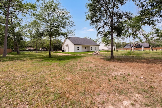 24601 Tipperary St, Hempstead, TX 77445 - view of yard with a detached garage