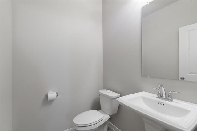 bathroom with sink and toilet