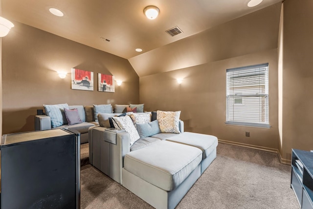 home theater room with baseboards, visible vents, lofted ceiling, recessed lighting, and dark colored carpet