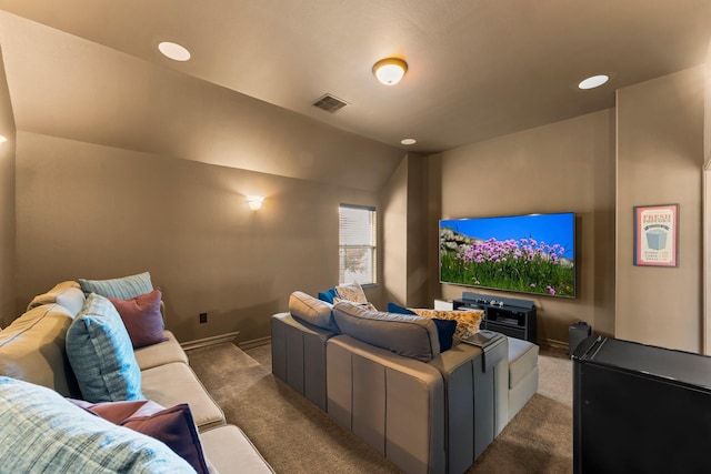 carpeted cinema room featuring recessed lighting, visible vents, baseboards, and vaulted ceiling