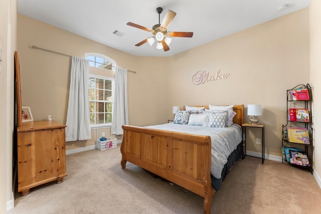 bedroom featuring light carpet, visible vents, ceiling fan, and baseboards