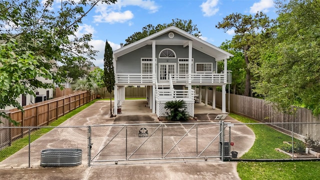 view of front of house with a carport and cooling unit