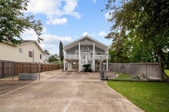 view of front facade with a carport and a front yard