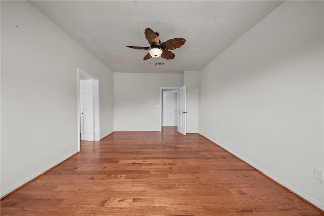 spare room with light hardwood / wood-style floors and ceiling fan