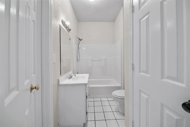 bathroom featuring vanity, tile patterned floors, and toilet