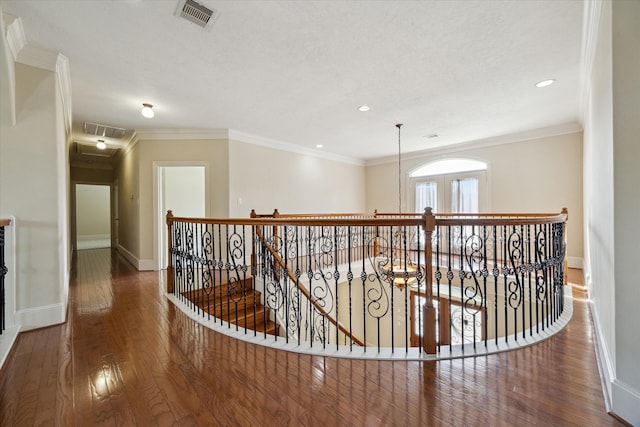 hallway featuring crown molding and dark wood-type flooring