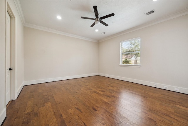 empty room featuring hardwood / wood-style flooring, ceiling fan, and crown molding