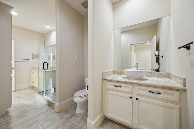 bathroom featuring tile patterned floors, vanity, an enclosed shower, and toilet