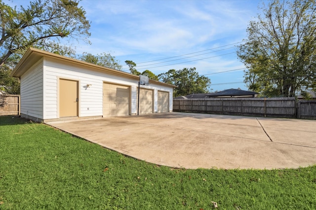 garage featuring a yard