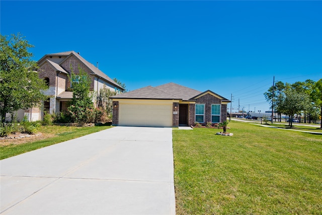 view of front of home featuring a garage and a front lawn