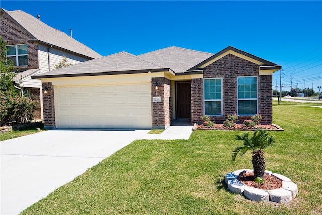 view of front of property featuring a front yard and a garage