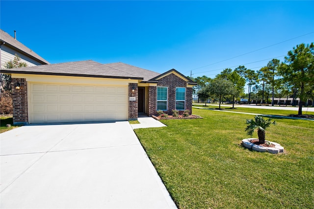 view of front of house featuring a front yard and a garage