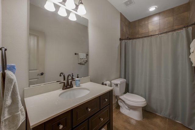 bathroom with tile patterned flooring, vanity, curtained shower, and toilet