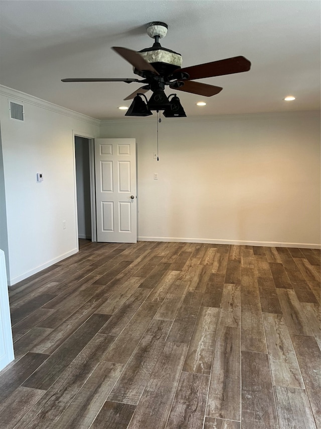 empty room featuring ceiling fan, dark hardwood / wood-style flooring, and ornamental molding