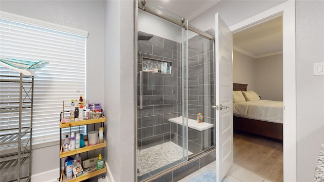 full bathroom featuring a stall shower, tile patterned floors, connected bathroom, and crown molding