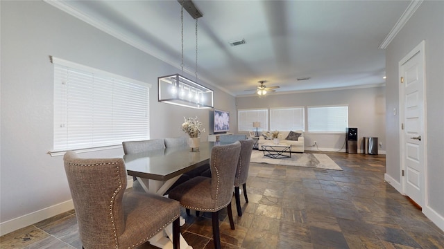 dining space featuring ceiling fan with notable chandelier and ornamental molding