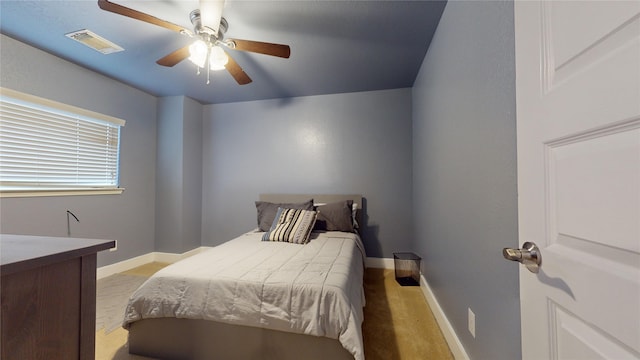 bedroom featuring baseboards, visible vents, and ceiling fan