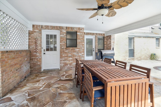 view of patio / terrace featuring area for grilling and ceiling fan