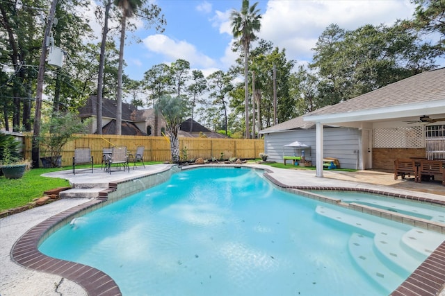 view of pool with an in ground hot tub, ceiling fan, and a patio area