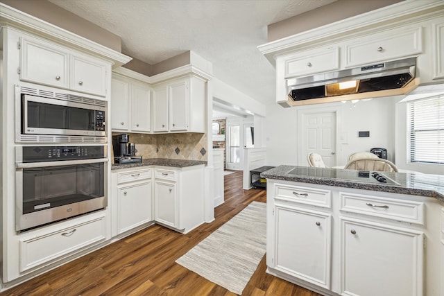 kitchen featuring appliances with stainless steel finishes and white cabinets