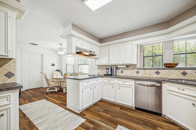 kitchen with white cabinetry, dark hardwood / wood-style flooring, decorative backsplash, stainless steel dishwasher, and kitchen peninsula