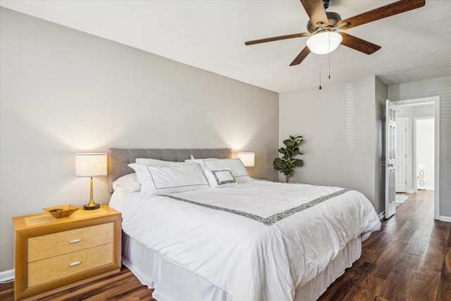 bedroom featuring ceiling fan and dark hardwood / wood-style floors