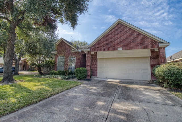 front of property with a front yard and a garage