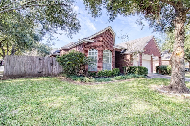 view of front property with a garage and a front lawn