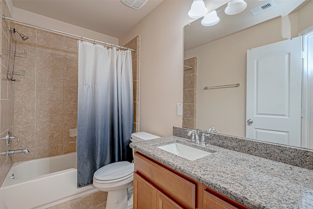 full bathroom featuring toilet, vanity, tile patterned floors, and shower / tub combo with curtain