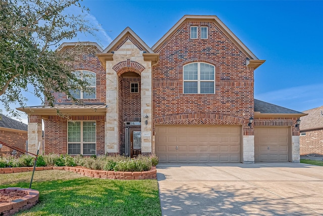 view of front of home with a front lawn and a garage