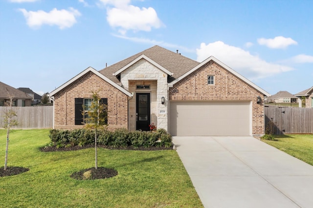 view of front facade with a garage and a front lawn