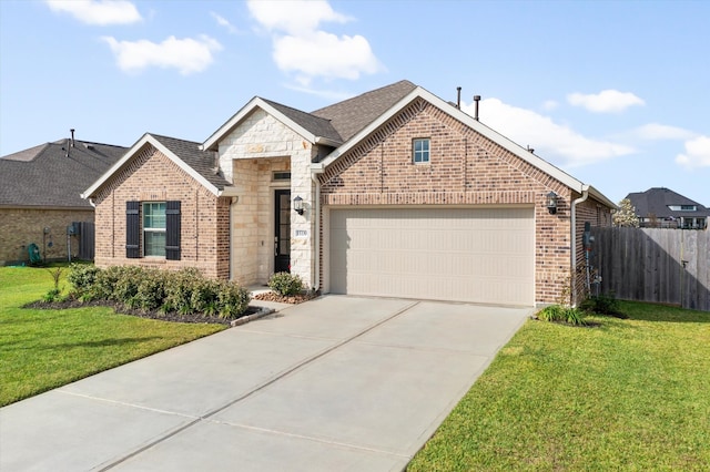 front facade featuring a garage and a front lawn