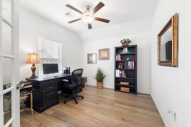 office area featuring vaulted ceiling, light hardwood / wood-style flooring, and ceiling fan