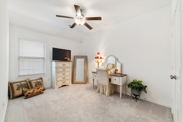 interior space featuring ceiling fan and light carpet