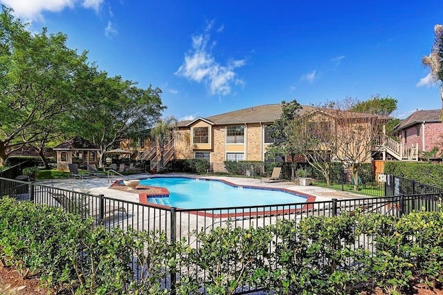 view of pool featuring a patio area