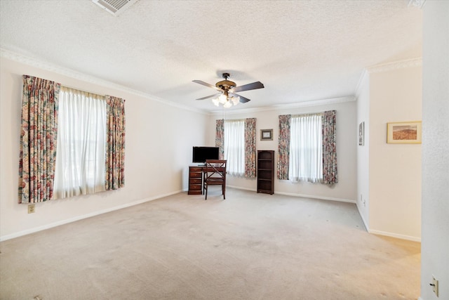 unfurnished living room featuring crown molding, ceiling fan, light carpet, and a textured ceiling