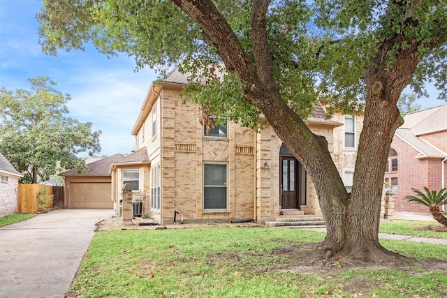 view of front of property featuring cooling unit and a front lawn