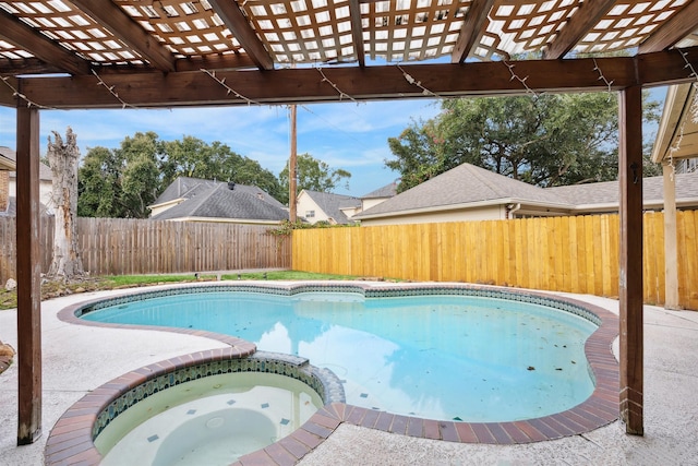 view of pool with an in ground hot tub