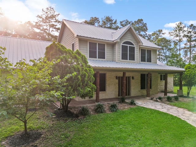 view of front of home with a lawn